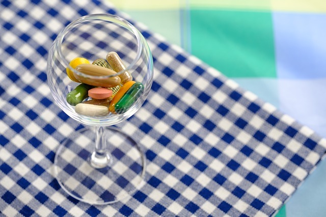 Vitamin E Deficiency Symptoms - A glass of vitamin capsules