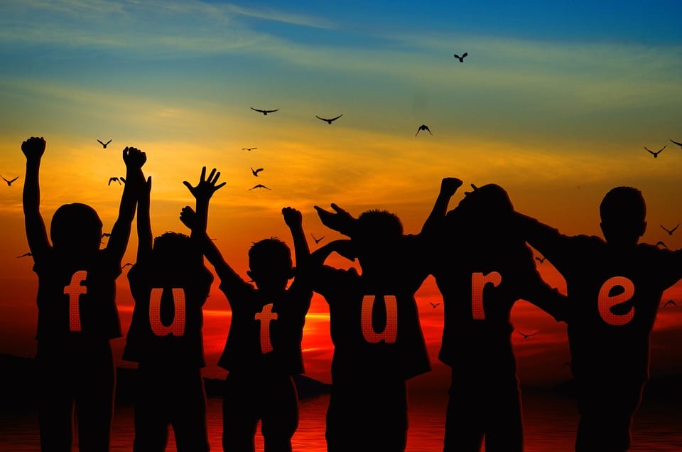 graphics of a silhouette of group of kids raising their hands